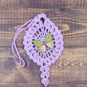 Green and Pink Butterfly on Pastel Purple