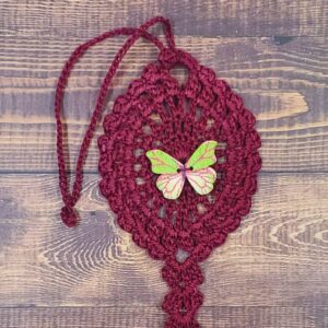 Green and Pink Butterfly on Burgundy