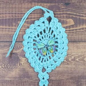 Kaleidoscope Butterfly on Pastel Teal